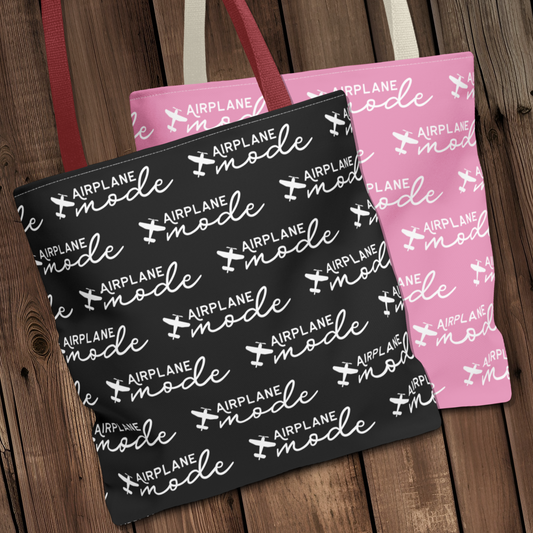 Airplane Mode tote bags for general aviation prop plane pilots by AviatrixA, one in black and one in pink with a repeating airplane pattern.
