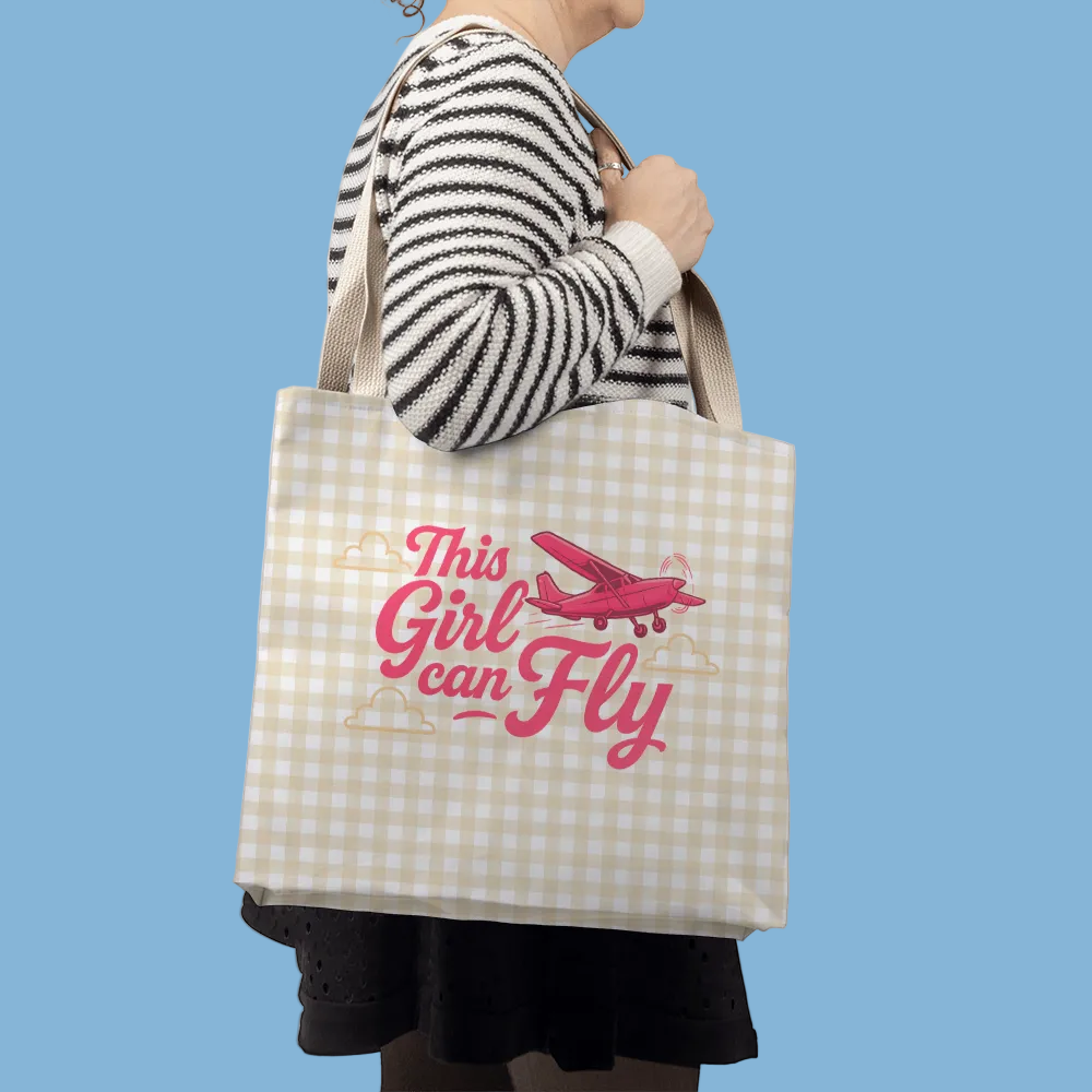 Side view of woman wearing striped shirt and black skirt with a khaki plaid tote bag over her shoulder